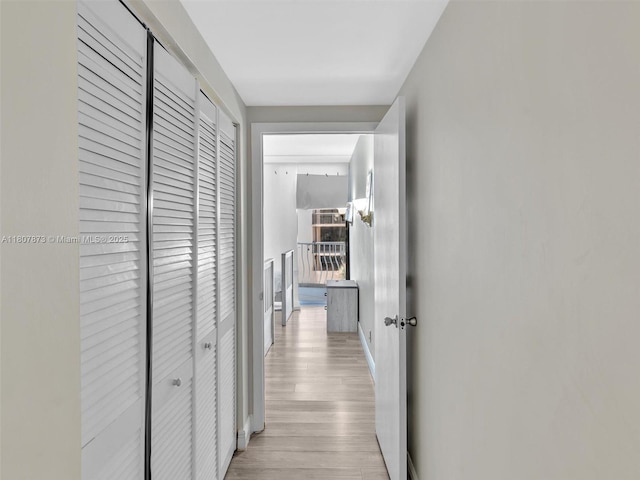 10155 Collins Ave Unit 408, Bal Harbour, FL 33154 - hall with light wood finished floors and baseboards
