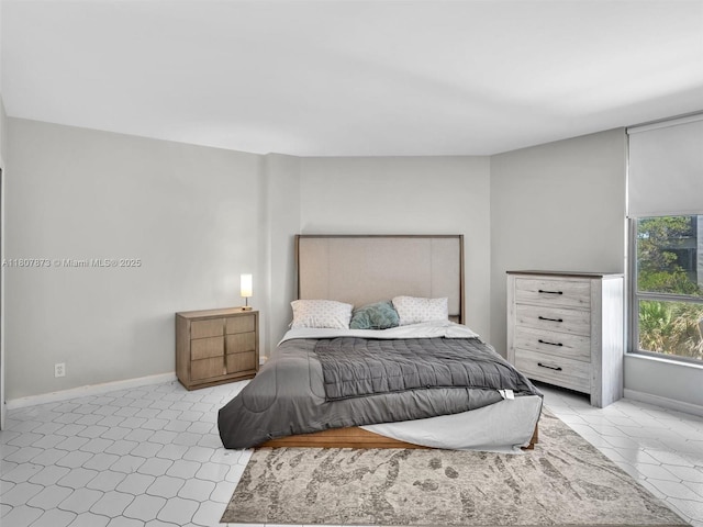 10155 Collins Ave Unit 408, Bal Harbour, FL 33154 - bedroom featuring baseboards and light tile patterned flooring