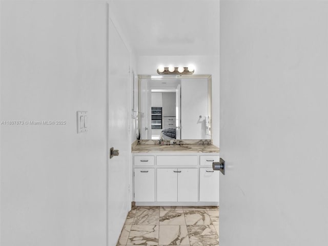 10155 Collins Ave Unit 408, Bal Harbour, FL 33154 - bathroom with marble look tiles and vanity
