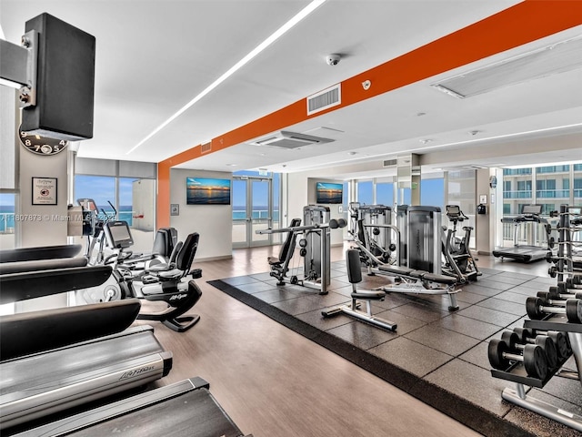 10155 Collins Ave Unit 408, Bal Harbour, FL 33154 - exercise room with healthy amount of natural light