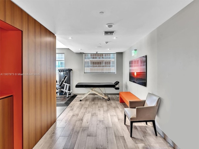 10155 Collins Ave Unit 408, Bal Harbour, FL 33154 - workout area featuring light wood-type flooring and baseboards