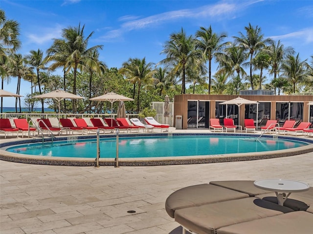 10155 Collins Ave Unit 408, Bal Harbour, FL 33154 - community pool featuring a patio