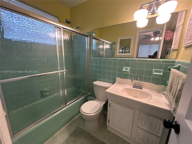 1717 Rodman St Unit 18, Hollywood, FL 33020 - bathroom featuring toilet, combined bath / shower with glass door, vanity, tile walls, and tile patterned floors