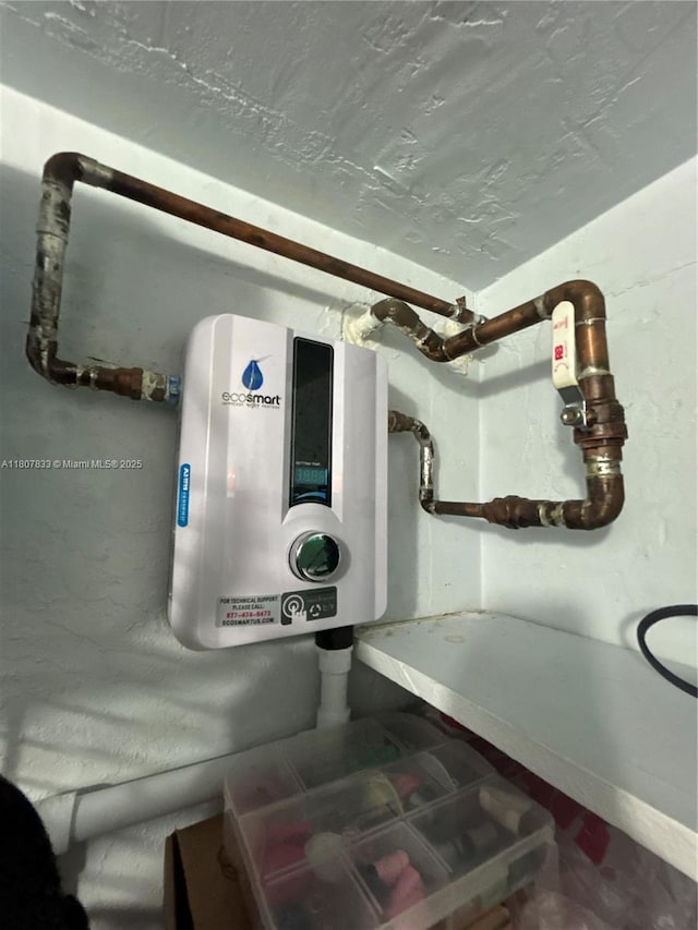 1717 Rodman St Unit 18, Hollywood, FL 33020 - detailed view of tankless water heater and baseboards