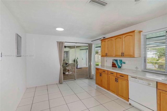 2001 NW 93rd Ln, Sunrise, FL 33322 - kitchen with white dishwasher, healthy amount of natural light, decorative backsplash, and light tile patterned floors