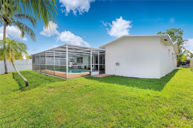 2001 NW 93rd Ln, Sunrise, FL 33322 - back of property featuring stucco siding, a lawn, and a lanai