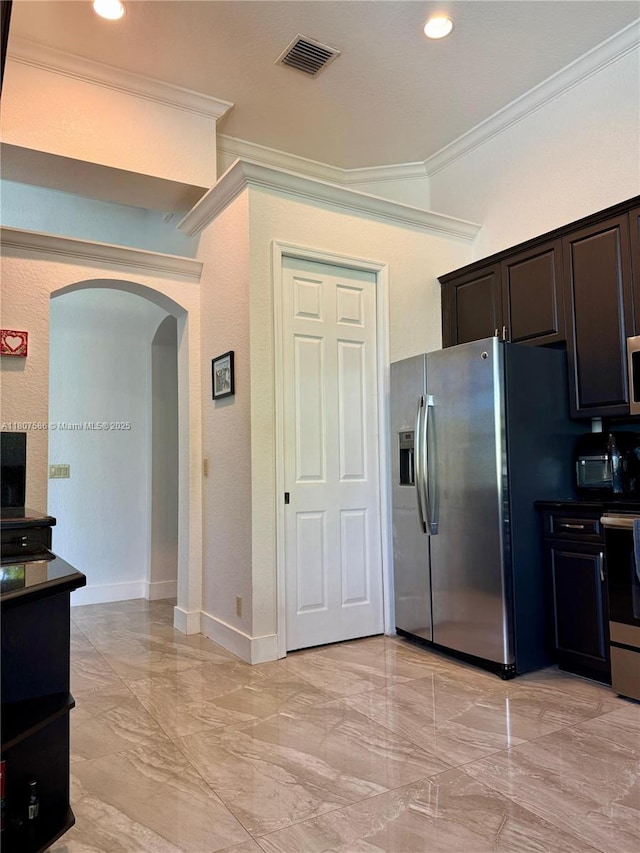 3700 Oak Ridge Ln, Weston, FL 33331 - kitchen with arched walkways, stainless steel appliances, crown molding, light marble finish flooring, and dark brown cabinetry
