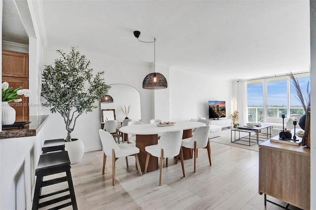 19380 Collins Ave Unit 718, Sunny Isles Beach, FL 33160 - dining room featuring light wood-type flooring and crown molding