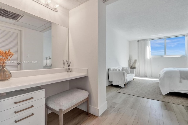 19380 Collins Ave Unit 718, Sunny Isles Beach, FL 33160 - bathroom with wood finished floors, ensuite bath, vanity, and baseboards