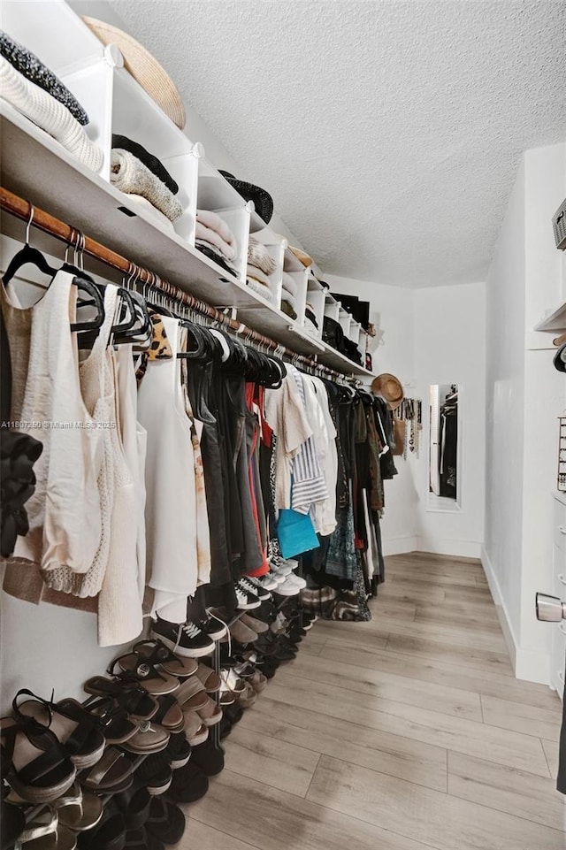 19380 Collins Ave Unit 718, Sunny Isles Beach, FL 33160 - walk in closet featuring wood finished floors