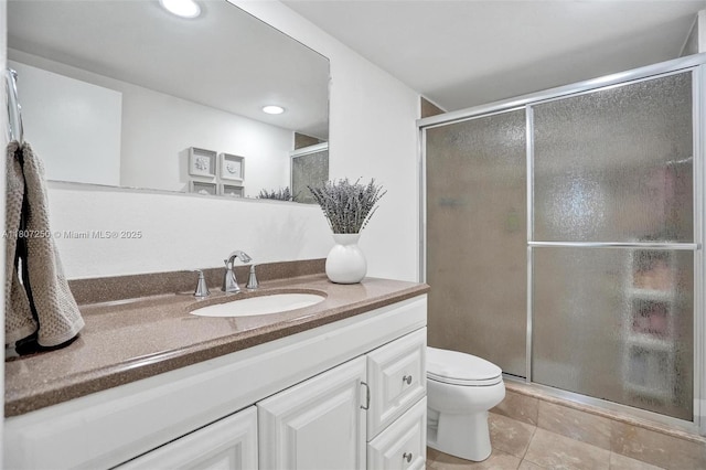 19380 Collins Ave Unit 718, Sunny Isles Beach, FL 33160 - bathroom featuring vanity, toilet, tile patterned floors, a shower with shower door, and recessed lighting