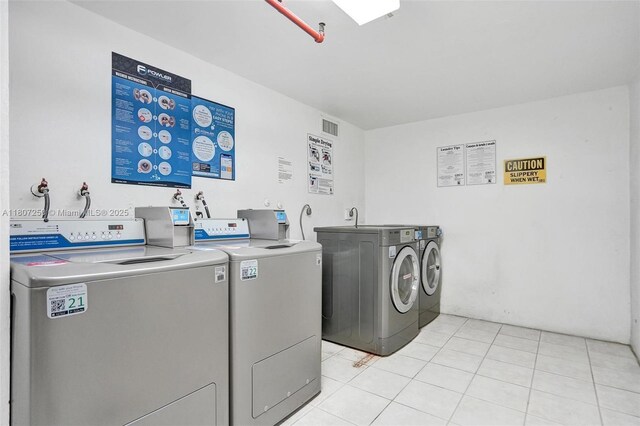 19380 Collins Ave Unit 718, Sunny Isles Beach, FL 33160 - shared laundry room featuring separate washer and dryer and light tile patterned floors