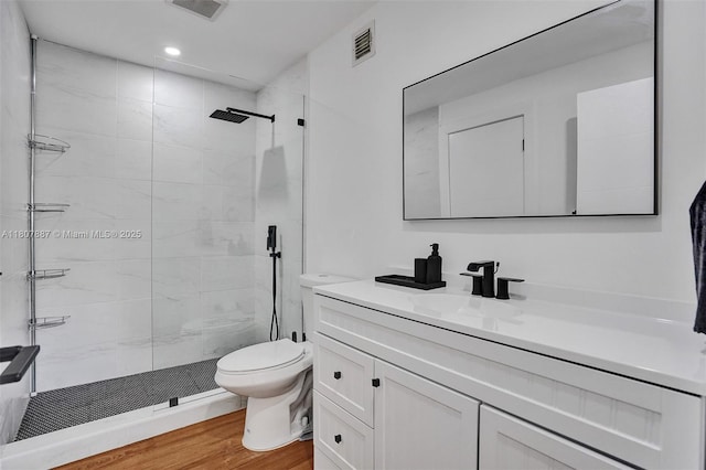 2978 SW 14th St, Miami, FL 33145 - bathroom with toilet, vanity, a stall shower, wood finished floors, and recessed lighting