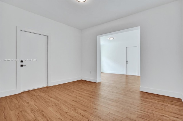 2978 SW 14th St, Miami, FL 33145 - empty room with light wood-style flooring and baseboards