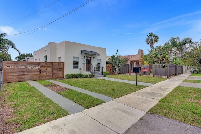2978 SW 14th St, Miami, FL 33145 - view of front of house with stucco siding and a gate