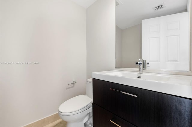 1755 E Hallandale Beach Blvd Unit 1604E, Hallandale Beach, FL 33009 - bathroom featuring toilet, vanity, baseboards, and tile patterned floors