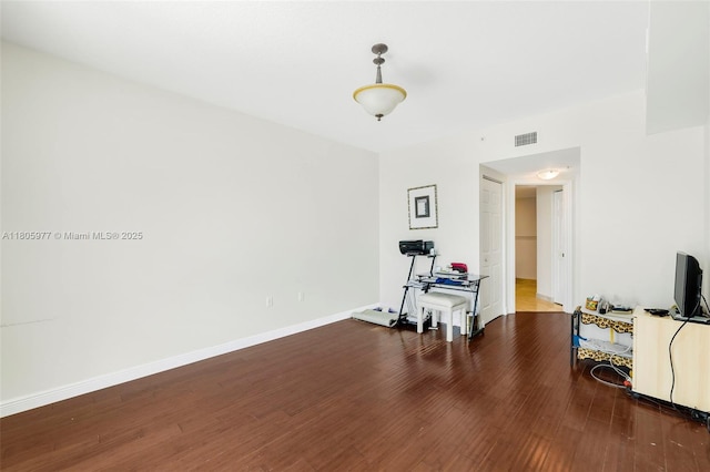 1755 E Hallandale Beach Blvd Unit 1604E, Hallandale Beach, FL 33009 - exercise room with wood finished floors and baseboards