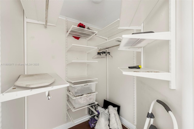 1755 E Hallandale Beach Blvd Unit 1604E, Hallandale Beach, FL 33009 - walk in closet featuring wood finished floors