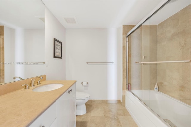 1755 E Hallandale Beach Blvd Unit 1604E, Hallandale Beach, FL 33009 - full bathroom featuring toilet, vanity, bath / shower combo with glass door, and baseboards
