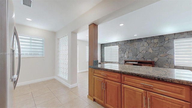 5301 SW 111th Ave, Miami, FL 33165 - kitchen with freestanding refrigerator, dark stone counters, and healthy amount of natural light