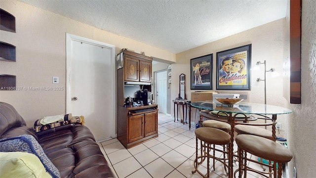 5301 SW 111th Ave, Miami, FL 33165 - living area with light tile patterned flooring, a textured ceiling, and a textured wall