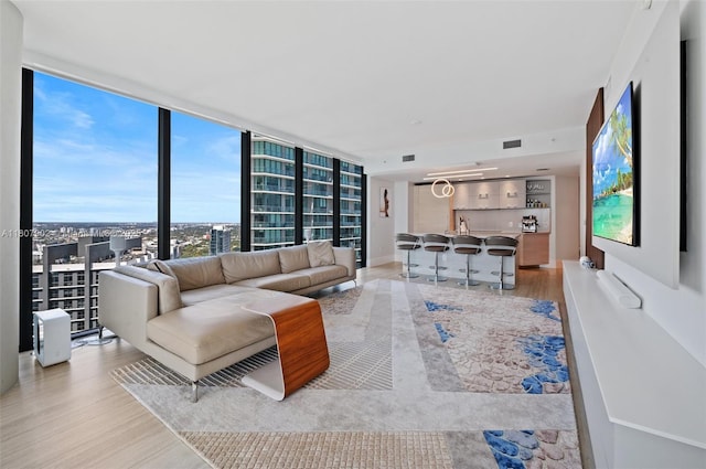 650 NE 32nd St Unit 4101, Miami, FL 33137 - living area with wood finished floors and a wall of windows