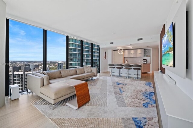 650 NE 32nd St Unit 4101, Miami, FL 33137 - living room featuring wood finished floors and floor to ceiling windows
