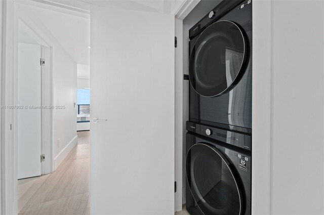 650 NE 32nd St Unit 4101, Miami, FL 33137 - laundry area featuring estacked washer and dryer and baseboards