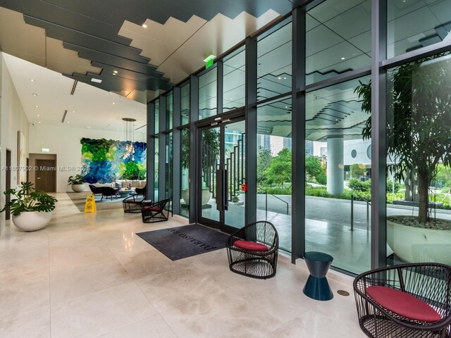 650 NE 32nd St Unit 4101, Miami, FL 33137 - building lobby with expansive windows and a high ceiling