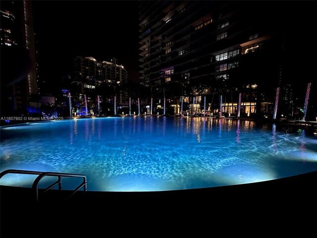 650 NE 32nd St Unit 4101, Miami, FL 33137 - pool at night featuring a view of city lights
