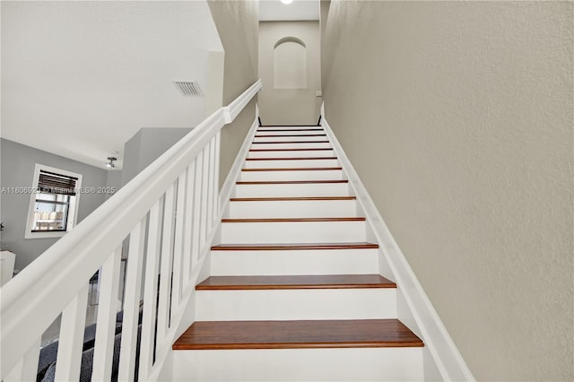 557 SE 37th Pl, Homestead, FL 33033 - staircase featuring a textured wall