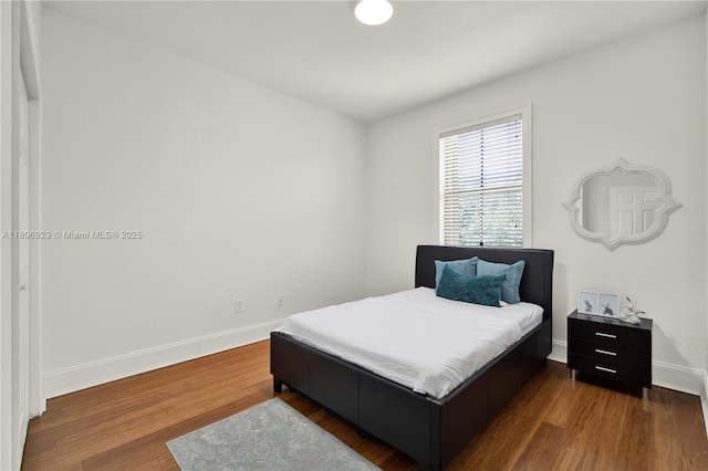 557 SE 37th Pl, Homestead, FL 33033 - bedroom featuring baseboards and dark wood finished floors