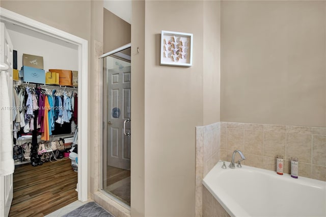 557 SE 37th Pl, Homestead, FL 33033 - bathroom featuring a garden tub, a stall shower, and a spacious closet
