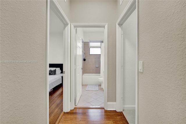 557 SE 37th Pl, Homestead, FL 33033 - corridor featuring a textured wall and wood finished floors