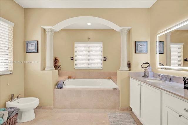7582 SW 191st St, Cutler Bay, FL 33157 - full bath featuring decorative columns, a bidet, vanity, a garden tub, and tile patterned flooring