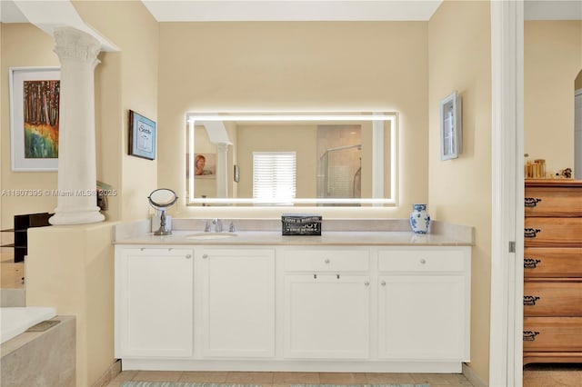 7582 SW 191st St, Cutler Bay, FL 33157 - full bath featuring ornate columns, vanity, a shower with shower door, and a garden tub