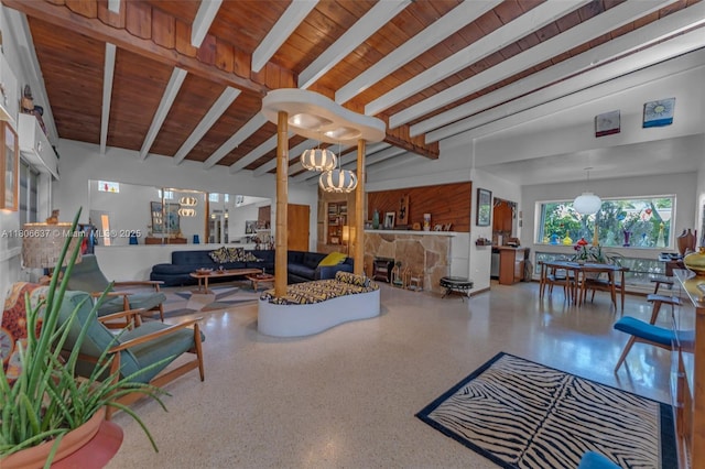 1895 SW 25th St, Miami, FL 33133 - living room featuring wood ceiling with exposed beams, speckle patterned floor, and a chandelier