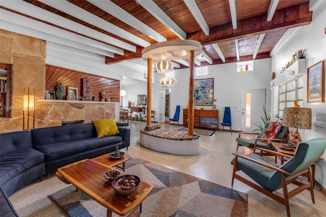 1895 SW 25th St, Miami, FL 33133 - living area featuring speckle patterned floor, wood ceiling with exposed beams, ornate columns, and baseboards