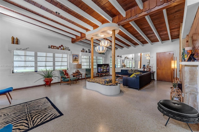 1895 SW 25th St, Miami, FL 33133 - living area with wooden ceiling with exposed beams, speckle patterned floor, and a chandelier