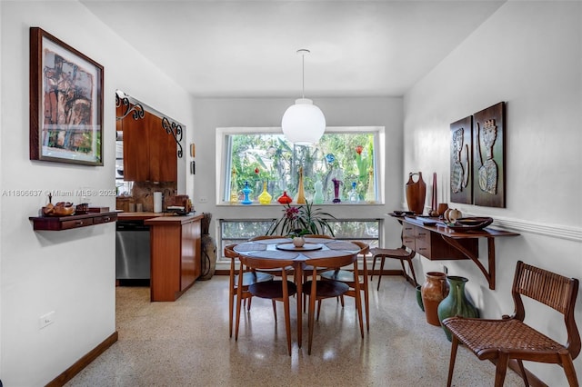 1895 SW 25th St, Miami, FL 33133 - dining room with dark aggregate flooring and baseboards