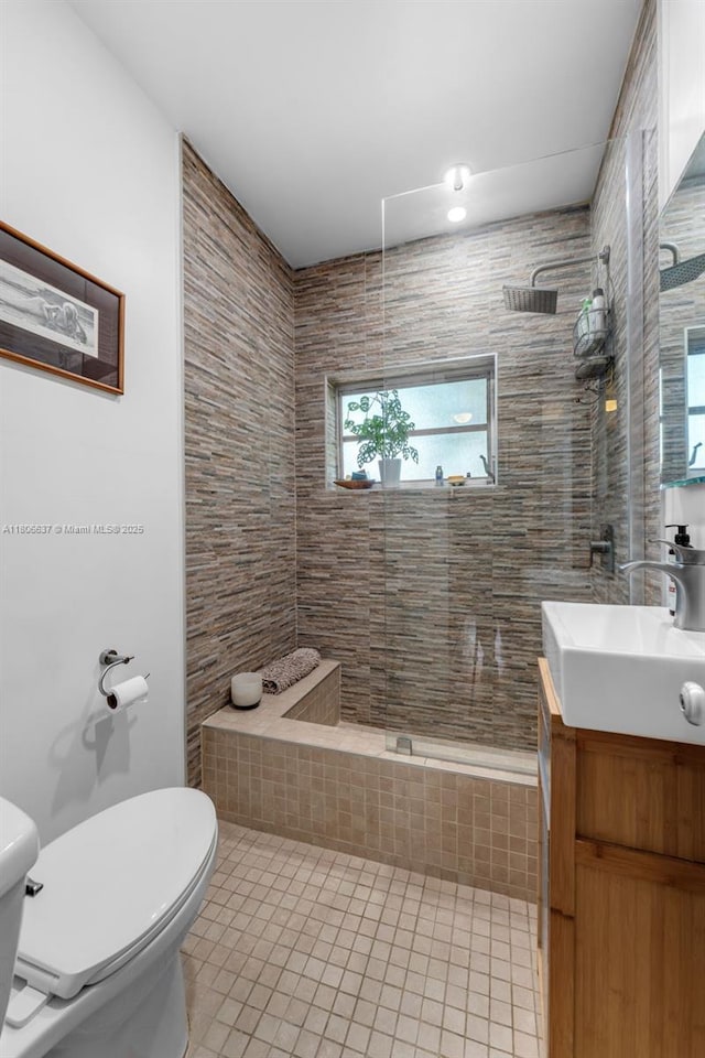 1895 SW 25th St, Miami, FL 33133 - full bathroom featuring toilet, vanity, tile patterned flooring, a walk in shower, and plenty of natural light