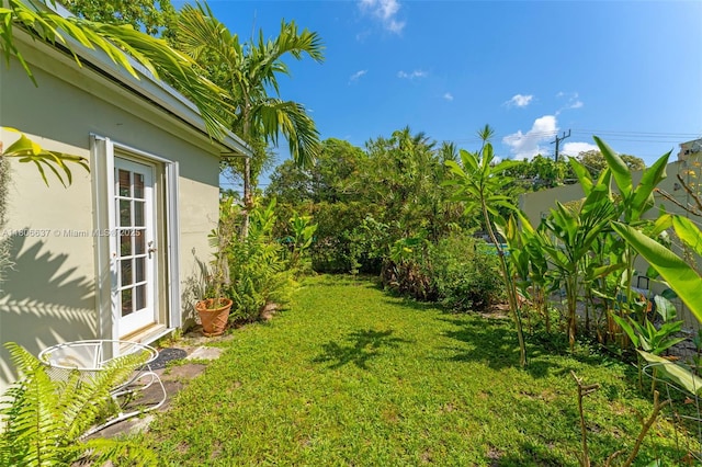 1895 SW 25th St, Miami, FL 33133 - view of green lawn with french doors