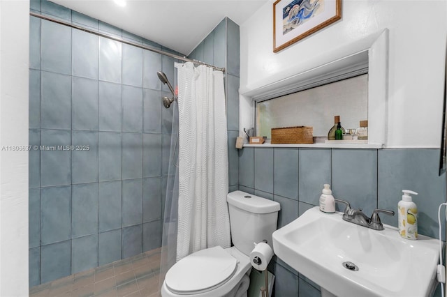 1895 SW 25th St, Miami, FL 33133 - bathroom featuring a sink, toilet, tiled shower, and tile walls