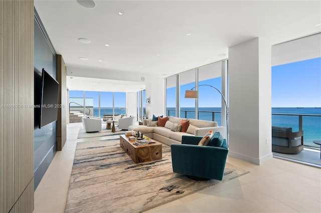 2200 N Ocean Blvd Unit N1102, Fort Lauderdale, FL 33305 - living area featuring a water view, light tile patterned flooring, and a wall of windows