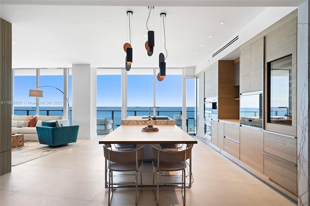 2200 N Ocean Blvd Unit N1102, Fort Lauderdale, FL 33305 - dining room featuring a wall of windows and a water view