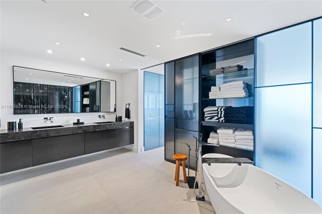 2200 N Ocean Blvd Unit N1102, Fort Lauderdale, FL 33305 - bathroom with a soaking tub, double vanity, and recessed lighting