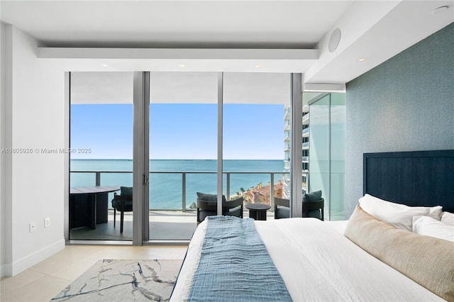 2200 N Ocean Blvd Unit N1102, Fort Lauderdale, FL 33305 - bedroom with floor to ceiling windows, multiple windows, a water view, and baseboards