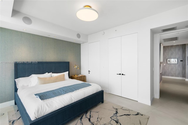 2200 N Ocean Blvd Unit N1102, Fort Lauderdale, FL 33305 - bedroom featuring wallpapered walls, baseboards, and multiple closets