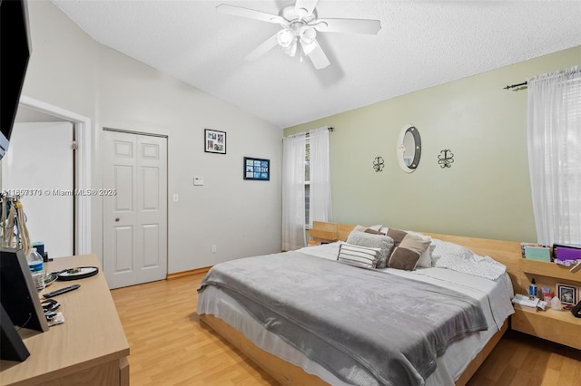 349 NW 207th Ave, Pembroke Pines, FL 33029 - bedroom with lofted ceiling, light wood finished floors, ceiling fan, and a textured ceiling