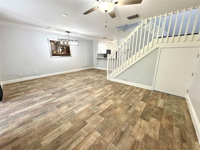 20866 NW 3rd Ln, Pembroke Pines, FL 33029 - unfurnished living room with a ceiling fan, wood finished floors, and stairway